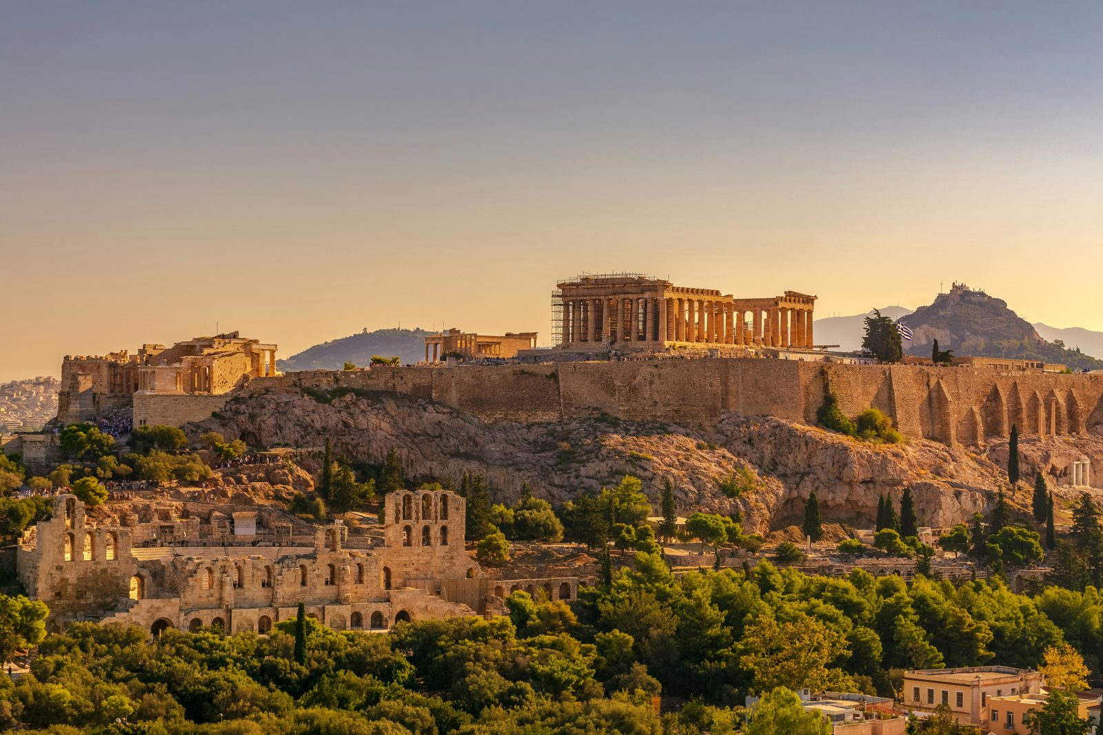 The Acropolis and the Parthenon at golden hour above Athens