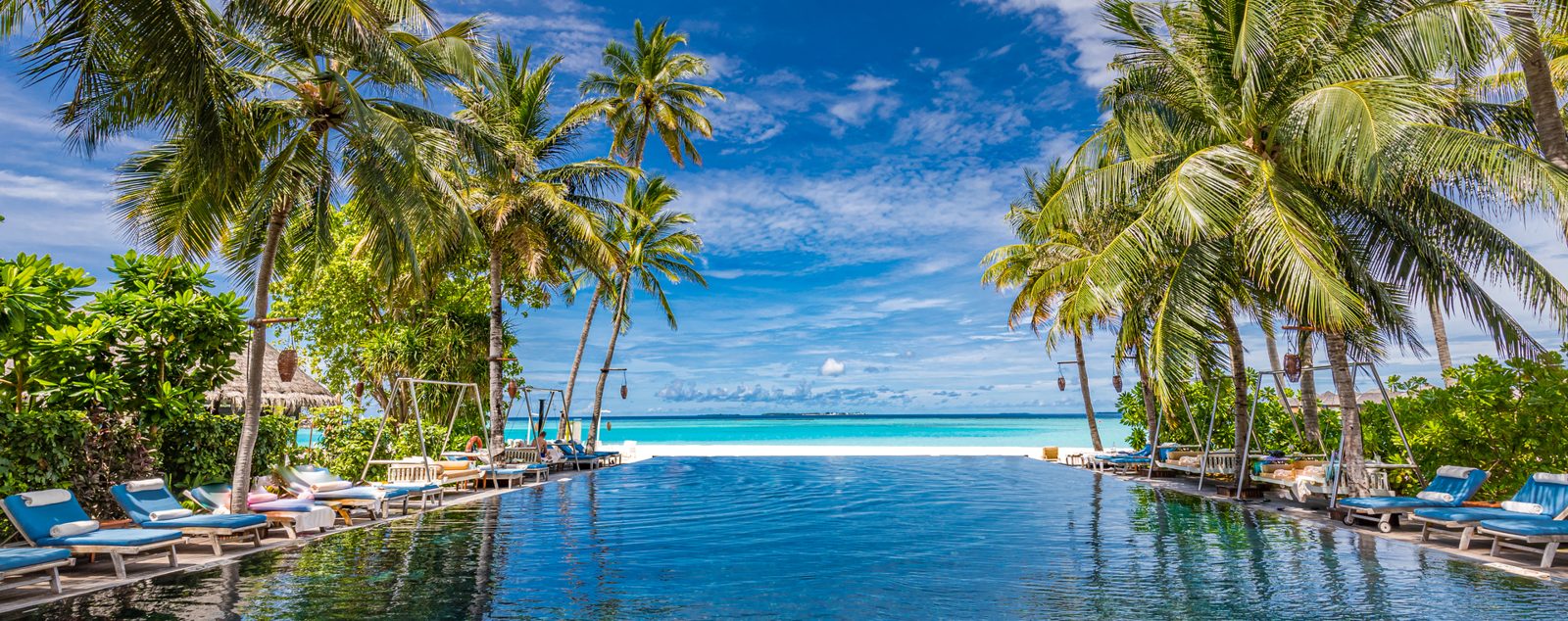 A resort infinity pool looking out over the sea